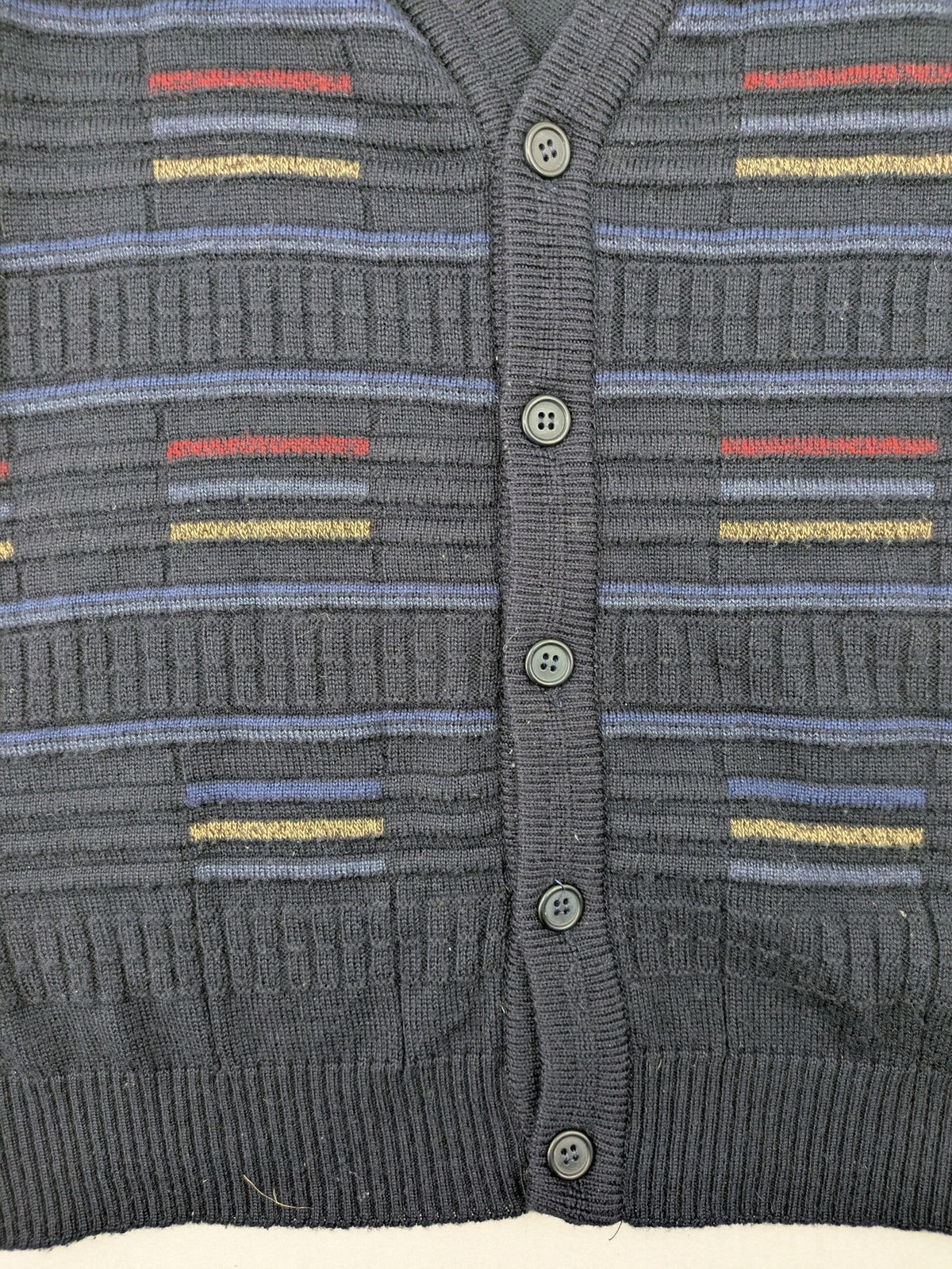 Via Cortesa gold turtle neck jumper with structured pattern and V-neck design.