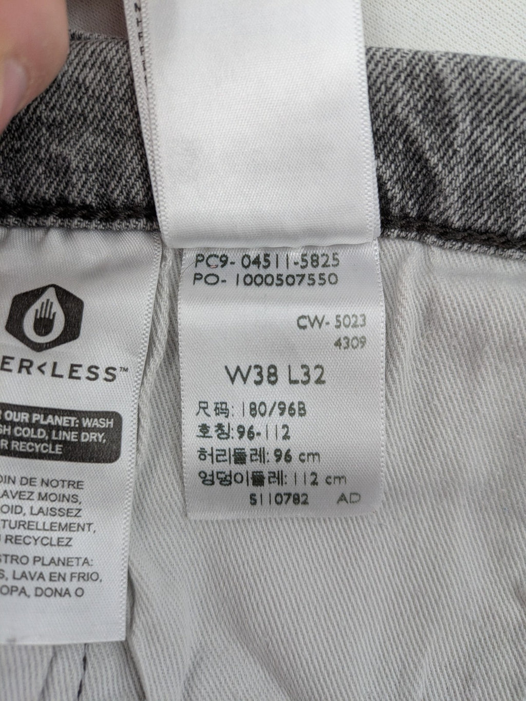 Levi's grey slim fit jeans with distressed knee details and classic logo patch.
