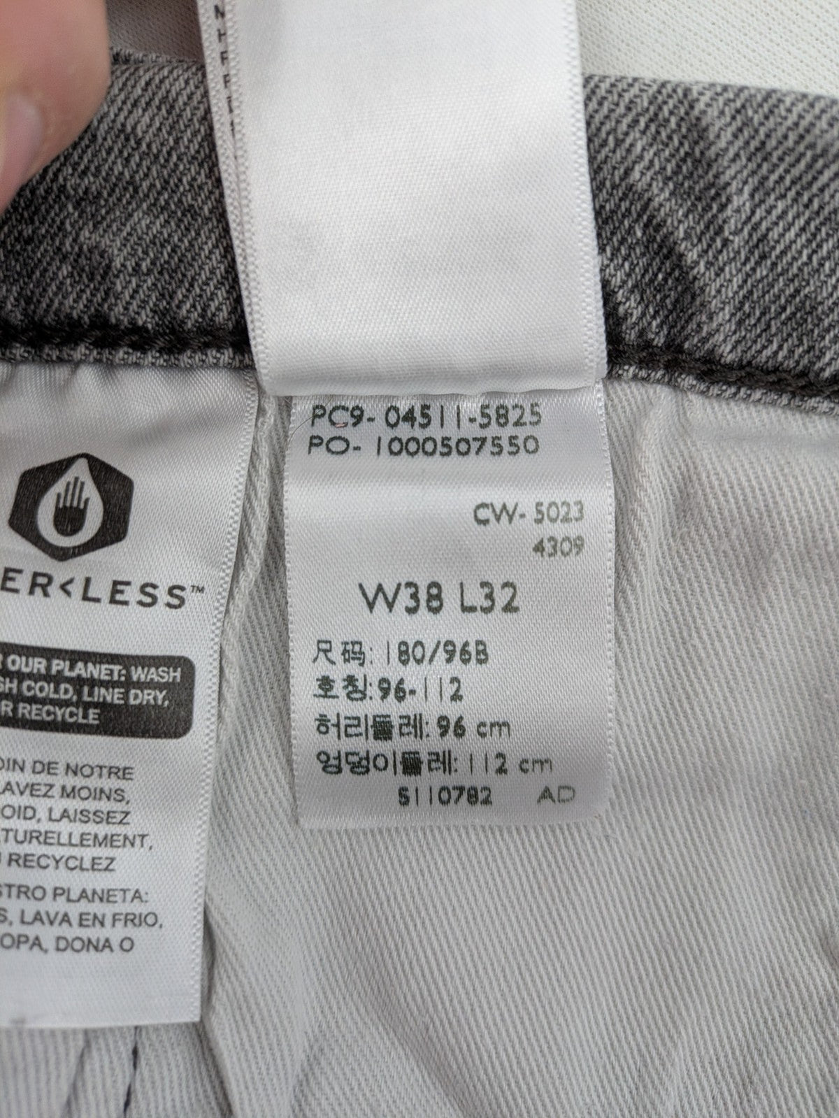 Levi's grey slim fit jeans with distressed knee details and classic logo patch.