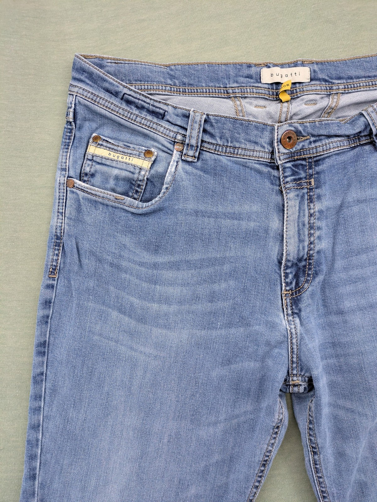 Bugatti blue straight jeans with classic 5-pocket design and light wash denim.