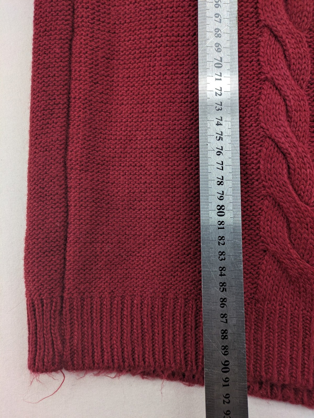 Pullover burgundy turtle neck jumper with diamond and cable knit patterns, elastic waistband.
