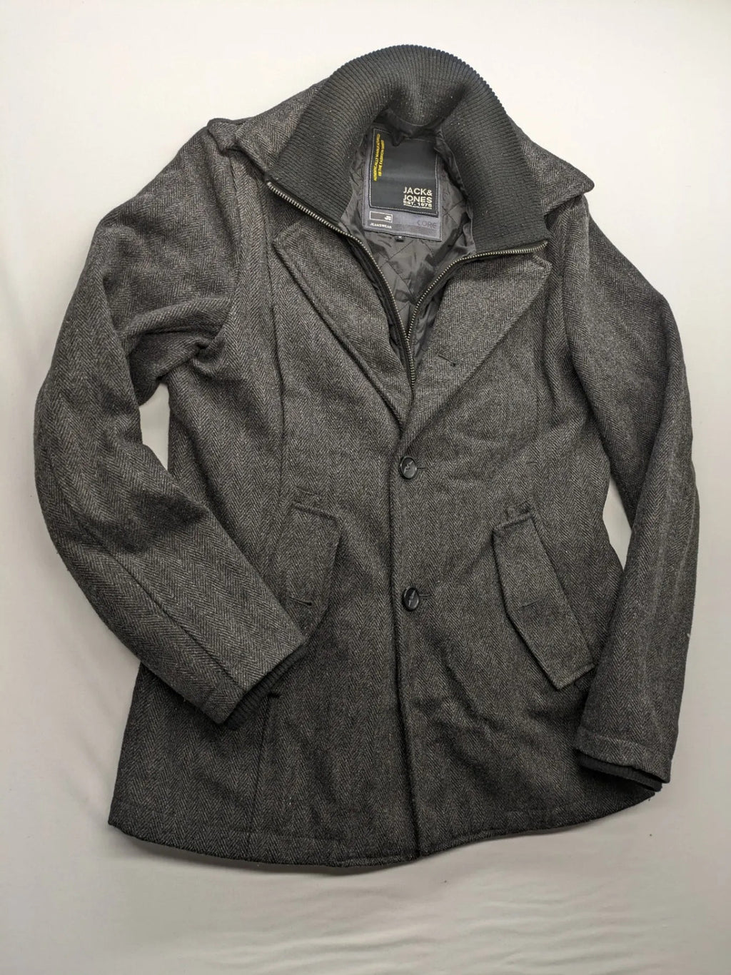 Jack & Jones grey coat herringbone pattern with two-button closure and side pockets.
