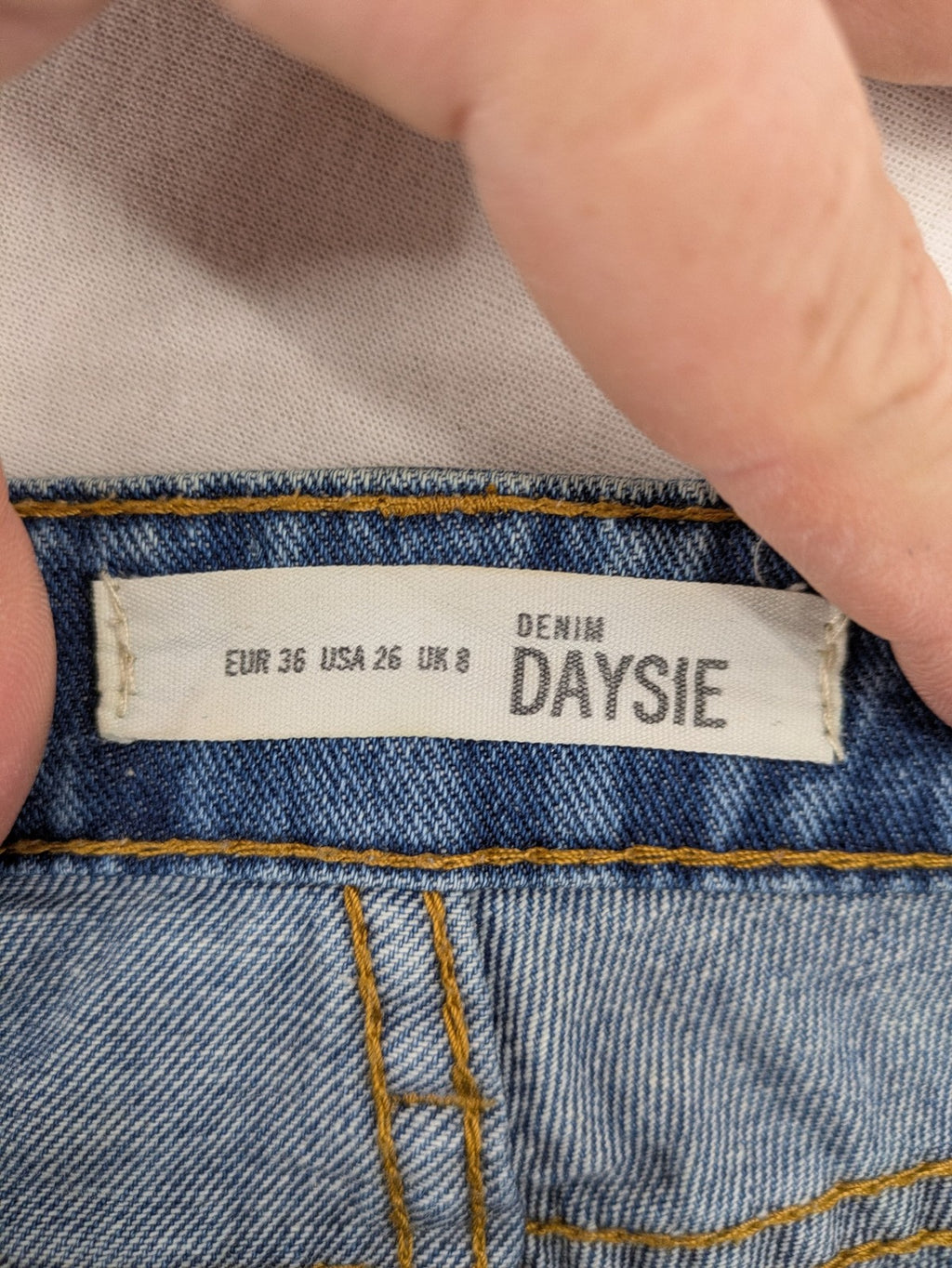 Daysie blue boyfriend jeans shorts with distressed rips and classic 5-pocket design.