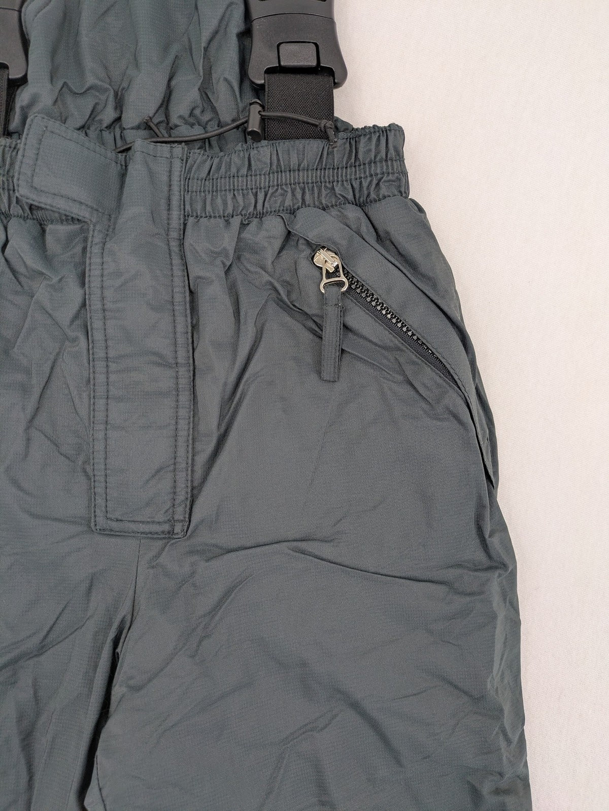 PROLINE grey winter ski pants with adjustable straps and insulated durable material.