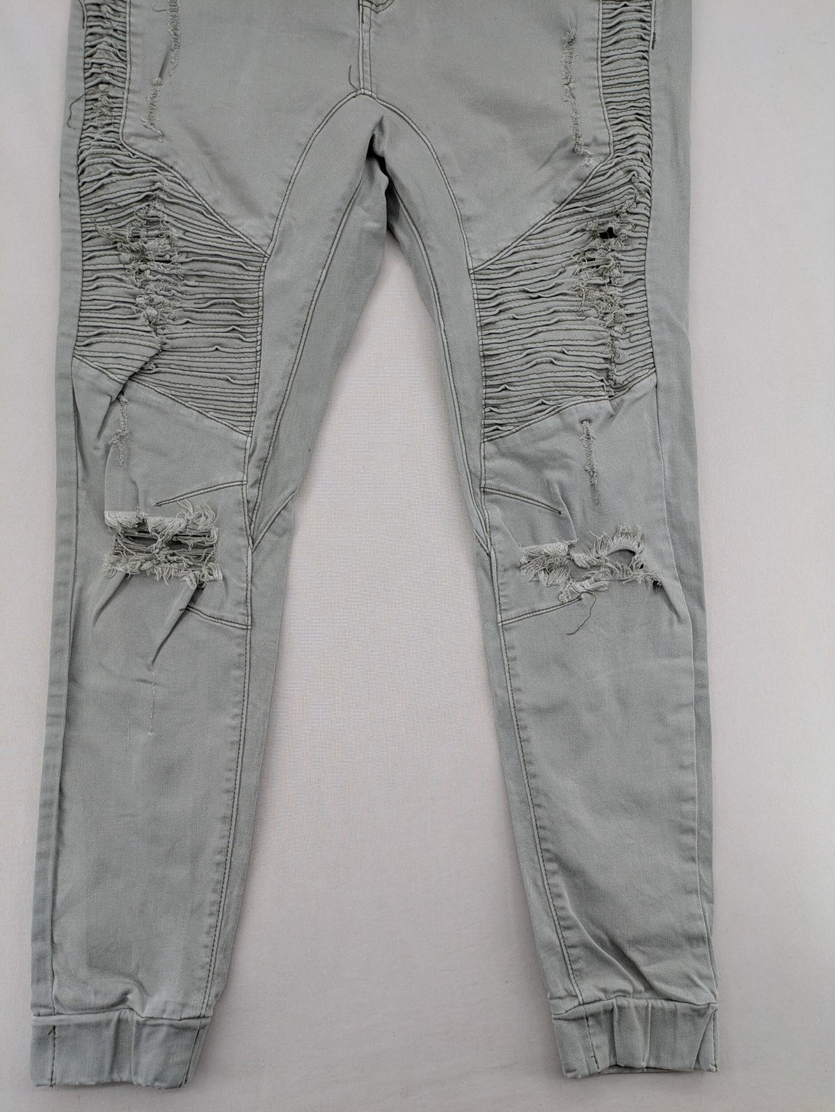 KSCY grey straight jeans with distressed details and ribbed biker inserts.