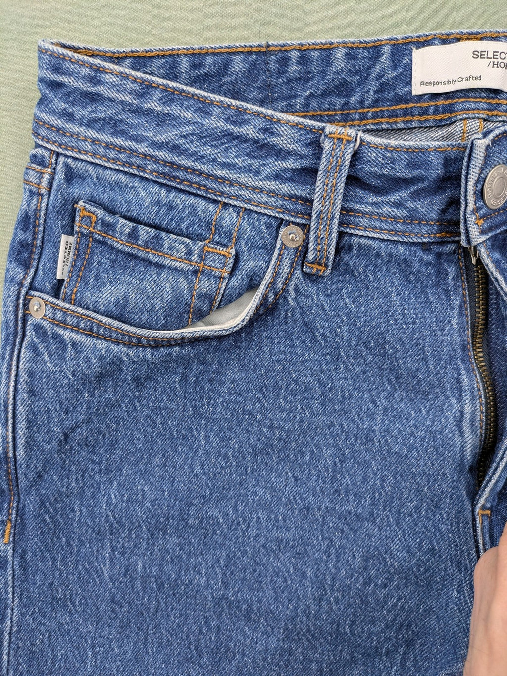 Selected Homme blue straight fit jeans with classic five-pocket design and medium wash denim.