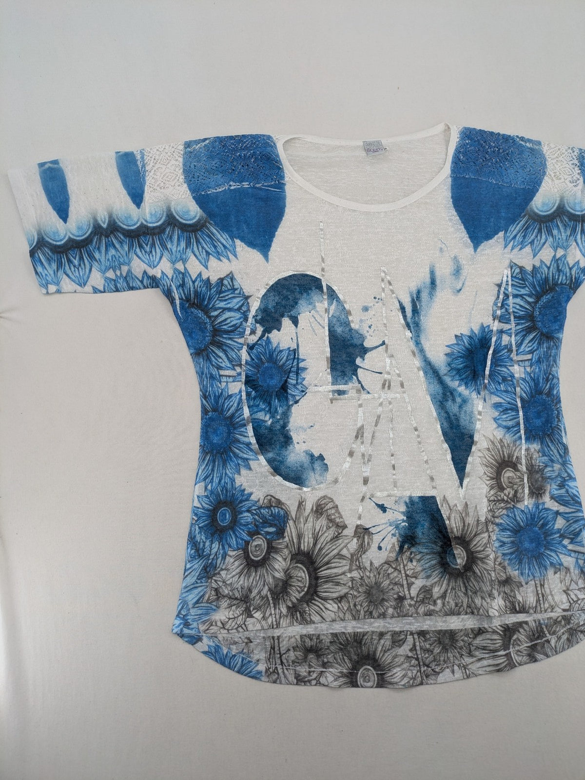 Liberty blue floral print top with metallic "LOVE" lettering, lightweight polyester material.