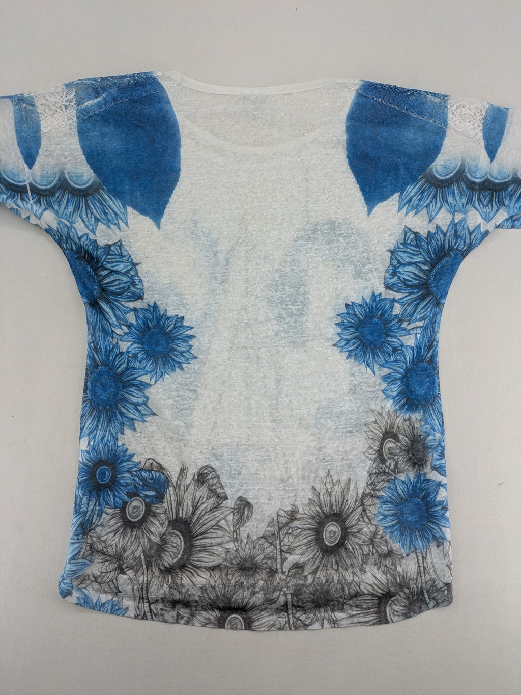 Liberty blue floral print top with metallic "LOVE" lettering, lightweight polyester material.