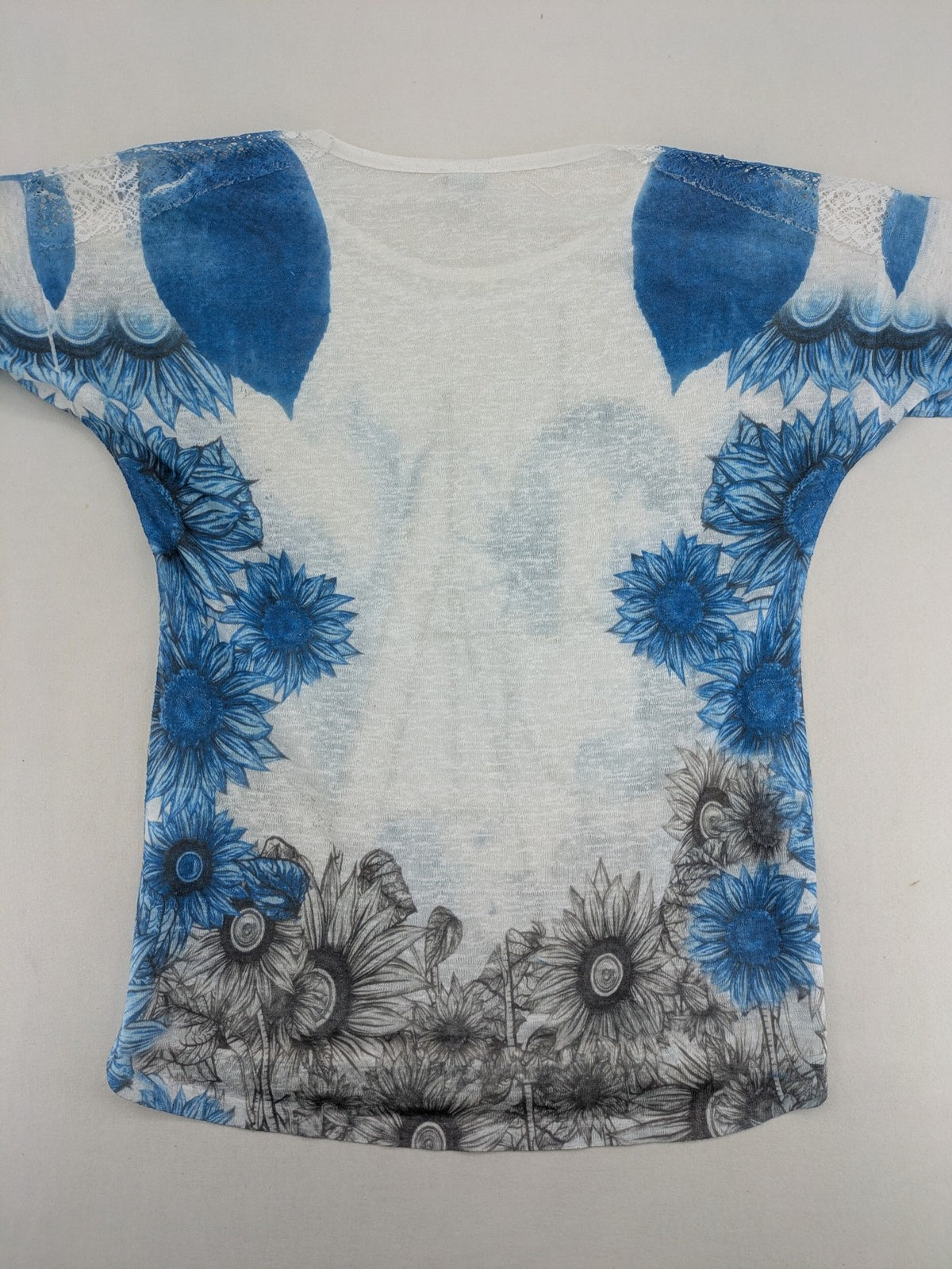Liberty blue floral print top with metallic "LOVE" lettering, lightweight polyester material.