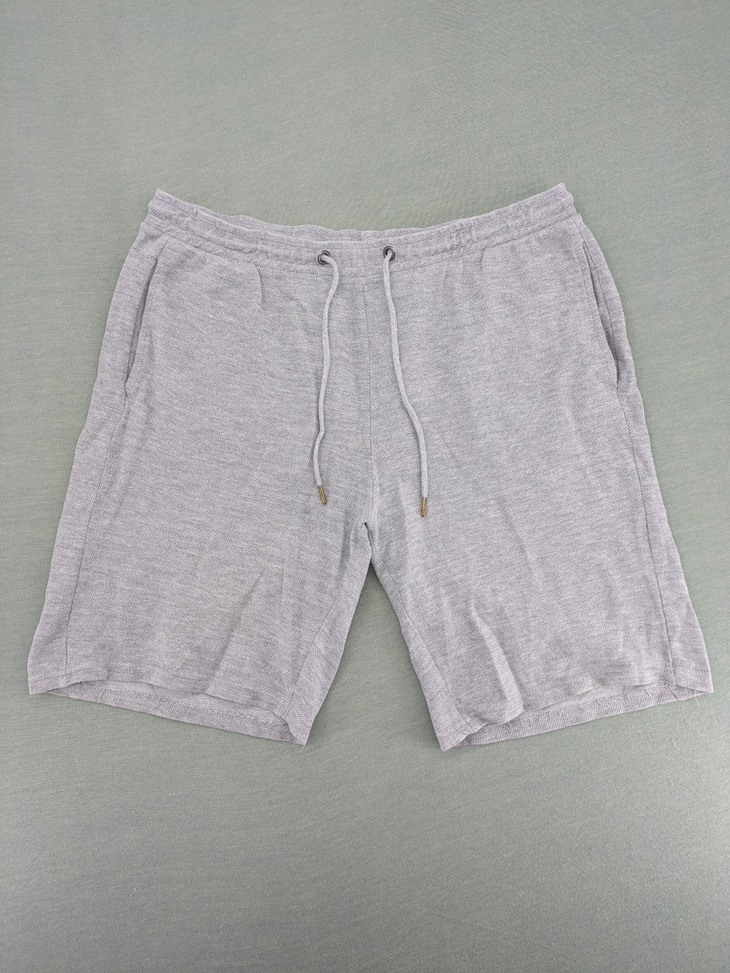 Livergy grey sweat shorts with elastic waistband, drawstring, and side pockets.
