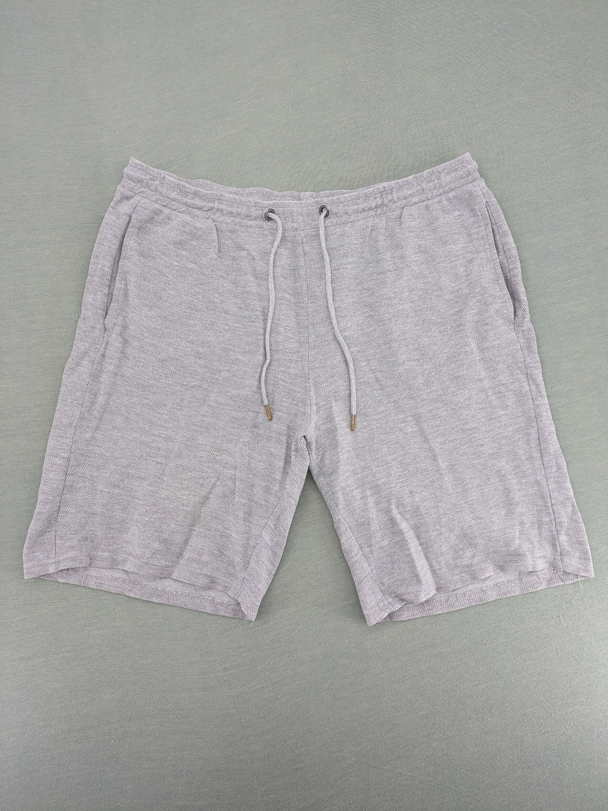 Livergy grey sweat shorts with elastic waistband, drawstring, and side pockets.
