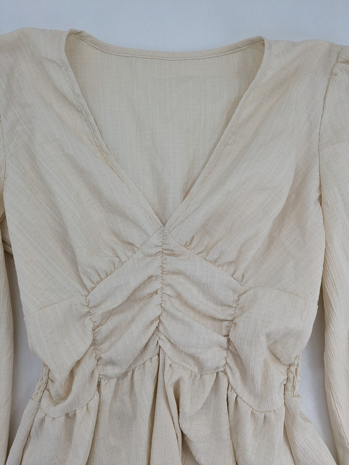 SHEIN beige bridal party dress with V-neck, ruffled bodice, and bishop sleeves.