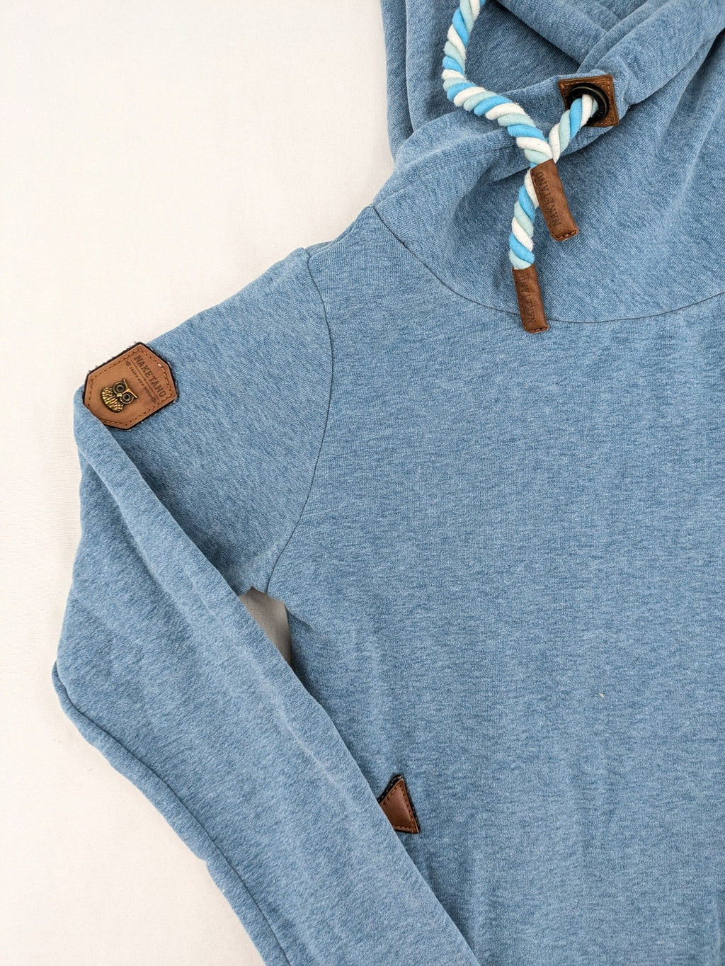 Naketano blue turtle neck jumper with unique collar and artistic leather details