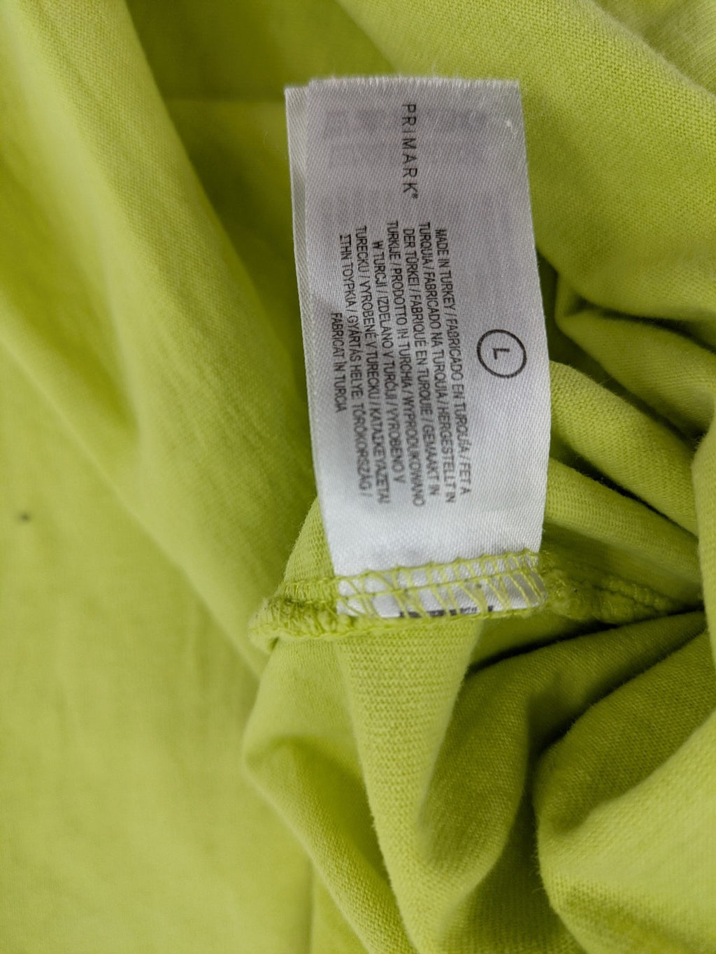 Primark yellow band t-shirt featuring Gothic LA graphic print and "PRESENT" patch.