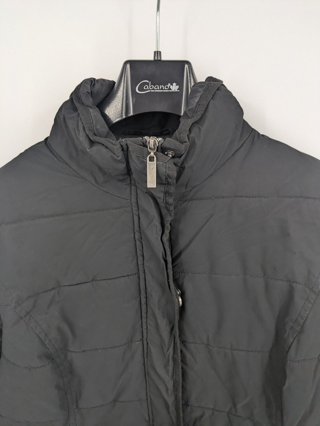 Mark Adam grey quilted jacket with high collar and buttoned flap pockets.