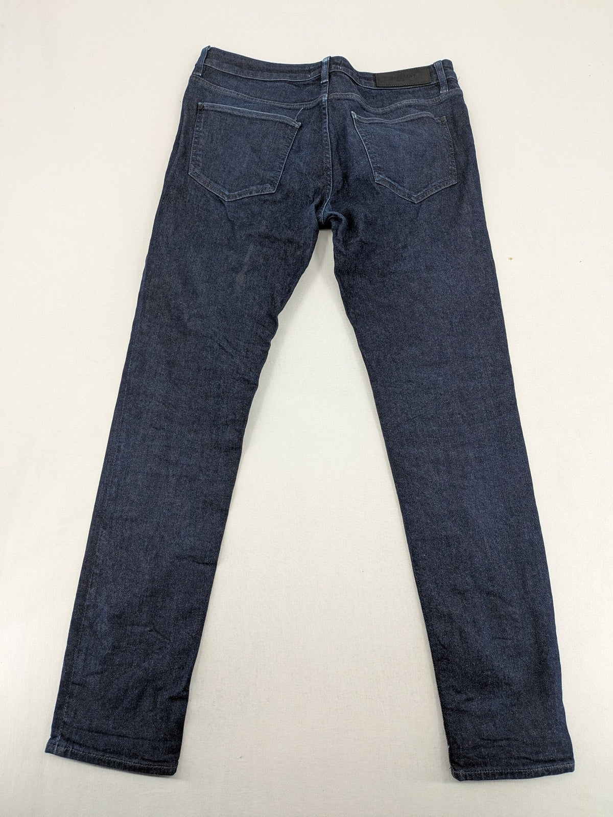 DISTRIKT NØRREBRO blue slim fit jeans with classic rinse wash and stretch denim material.
