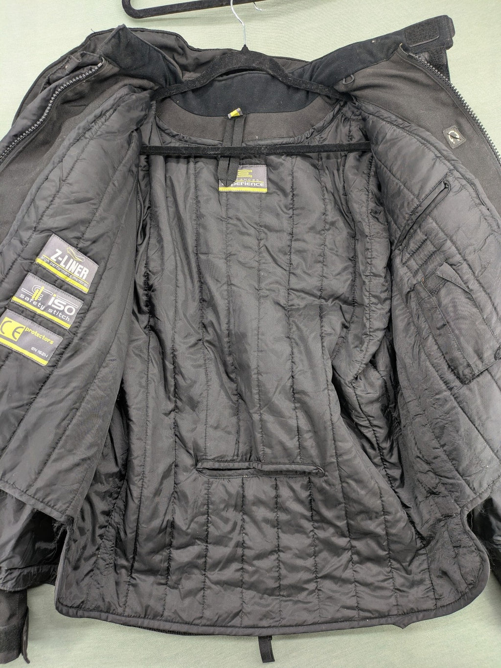 Advanced Experience black motorcycle jacket with Z-Liner membrane and CE protectors, durable Cordura material.