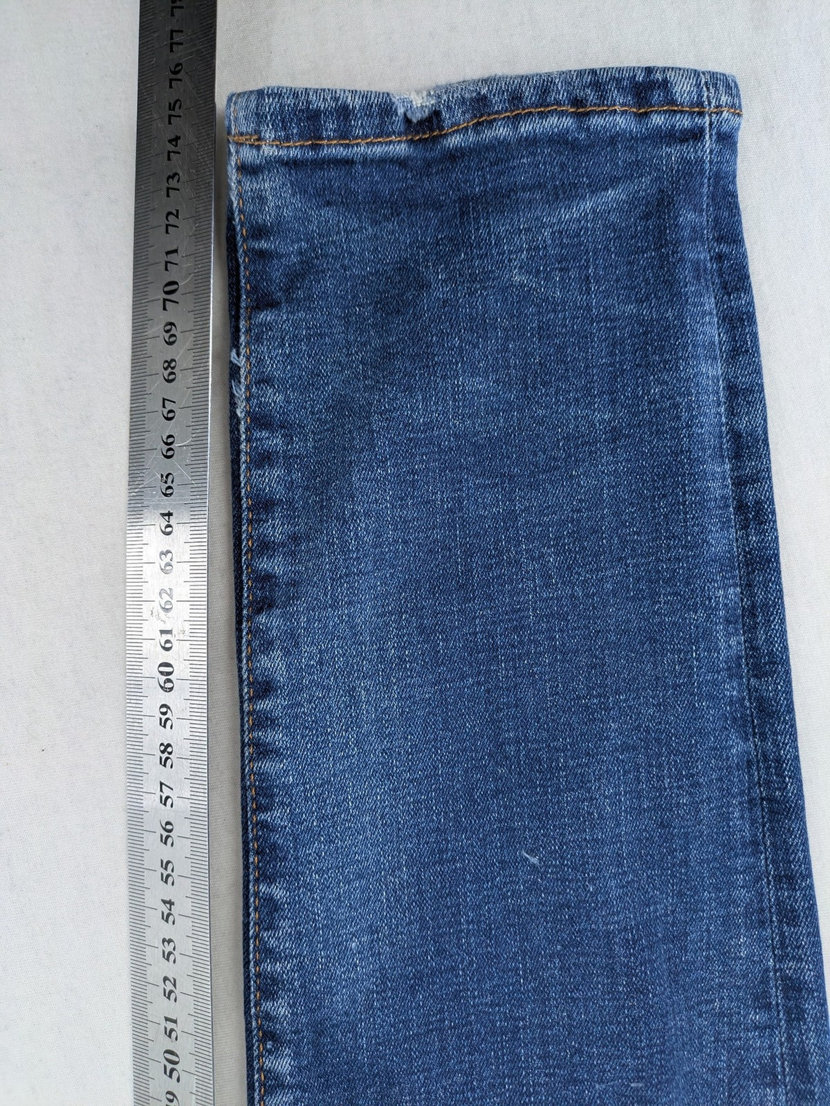 ICON 2 blue slim fit jeans distressed stretch denim with button fly and faded details.