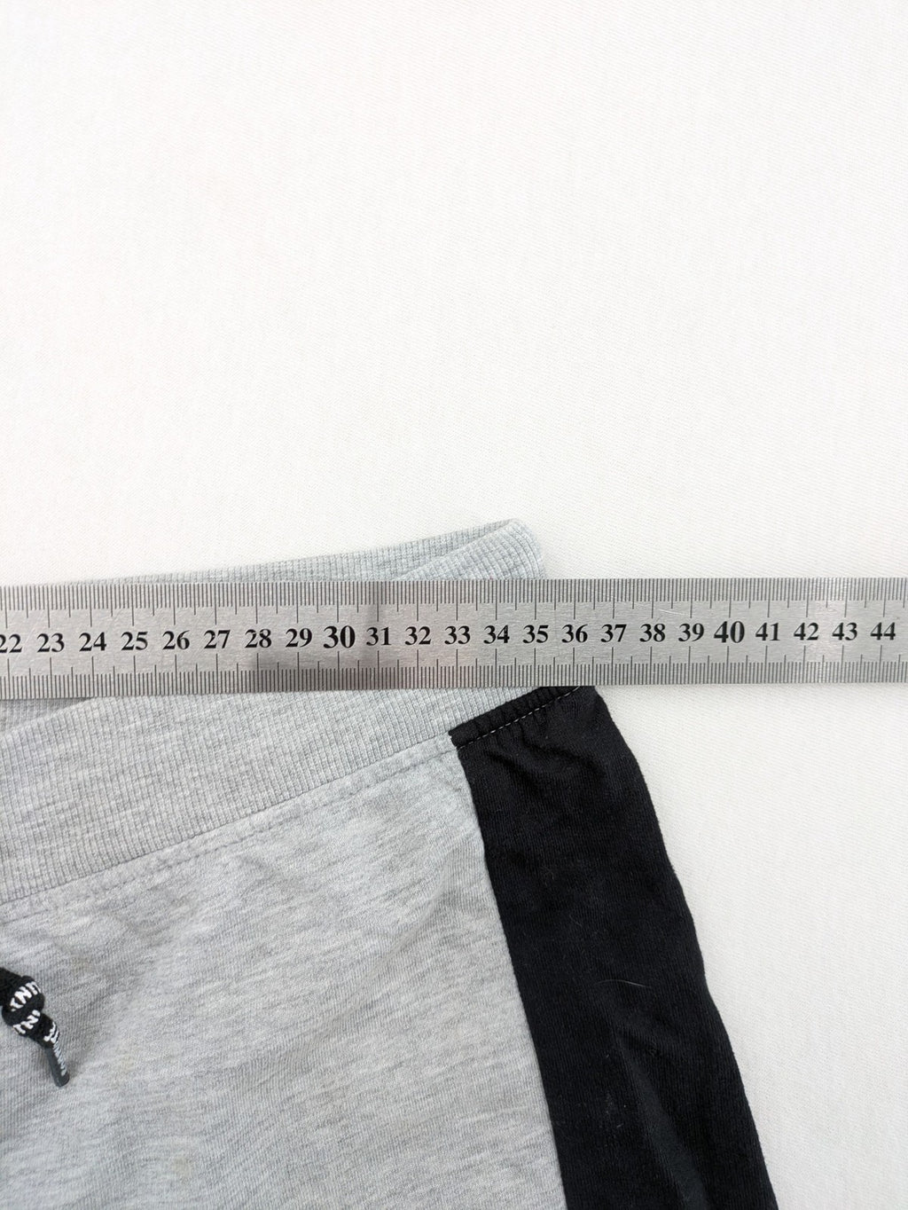 Fortnite pants grey with black side stripes and large logo print, cotton blend material.