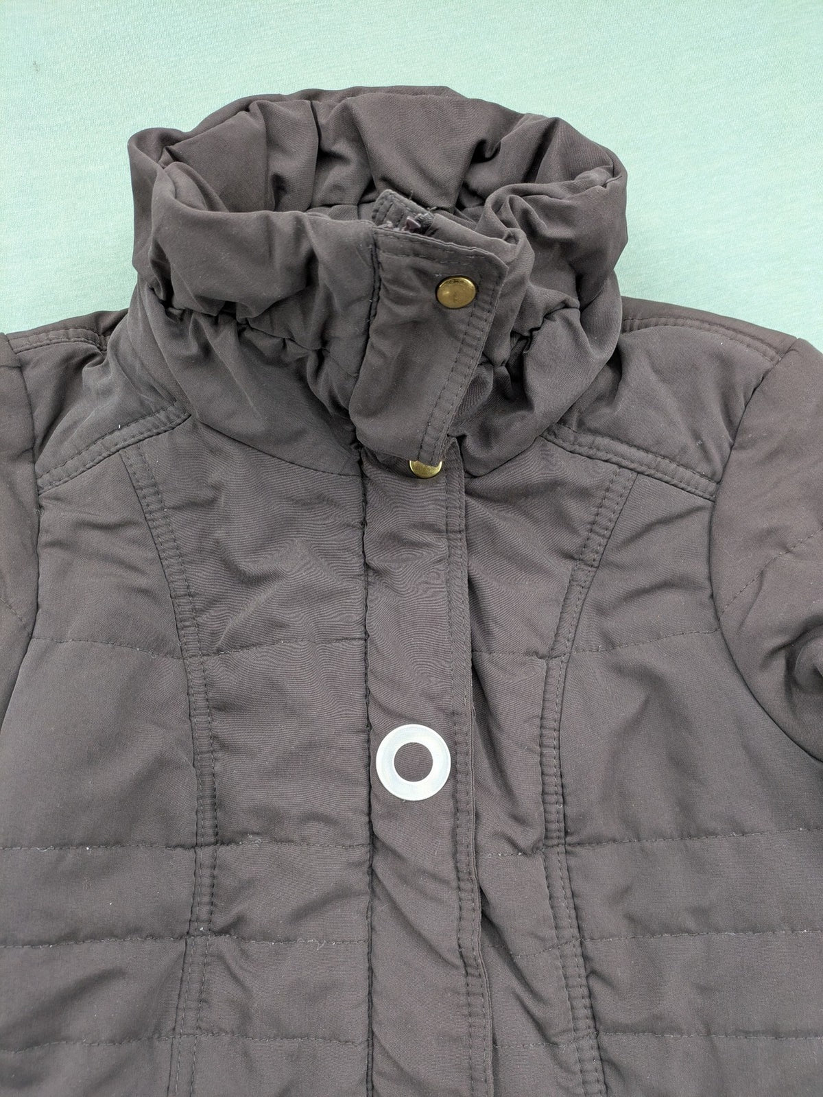 Vero Moda grey quilted jacket with high funnel neck and zippered pockets.