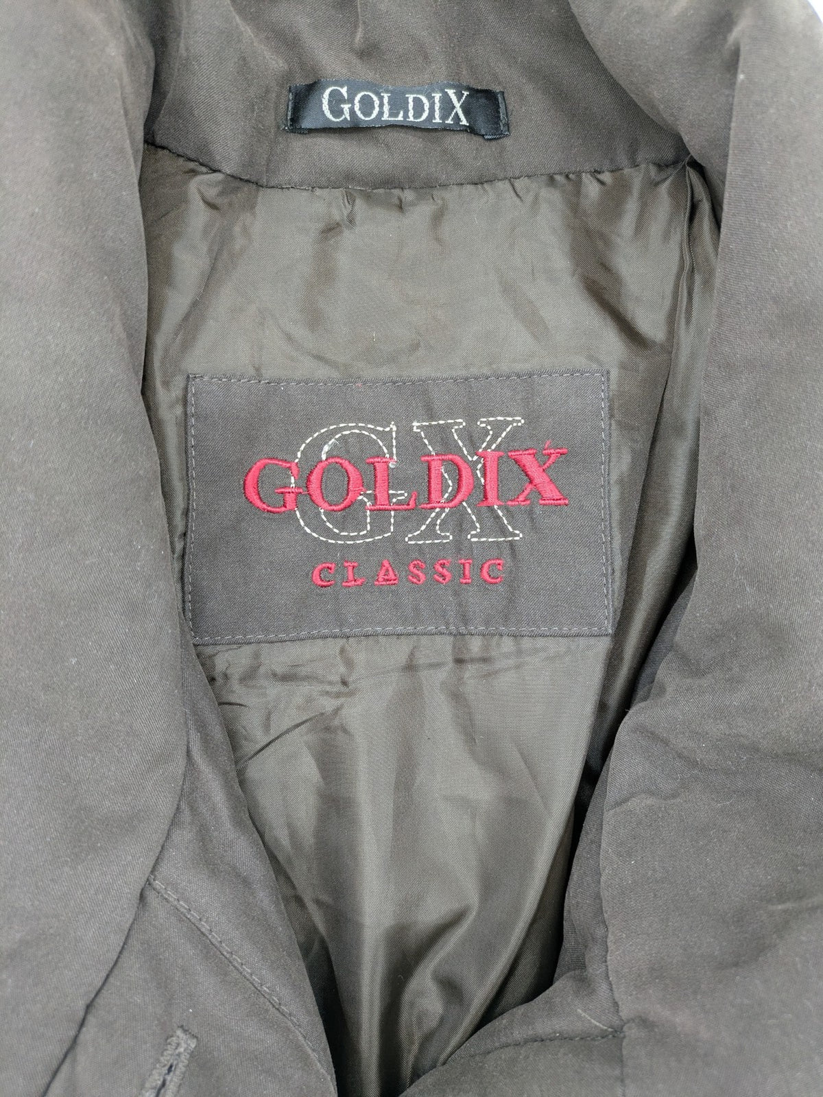 Goldix brown puffer coat size 46, button closure, padded design, classic style.