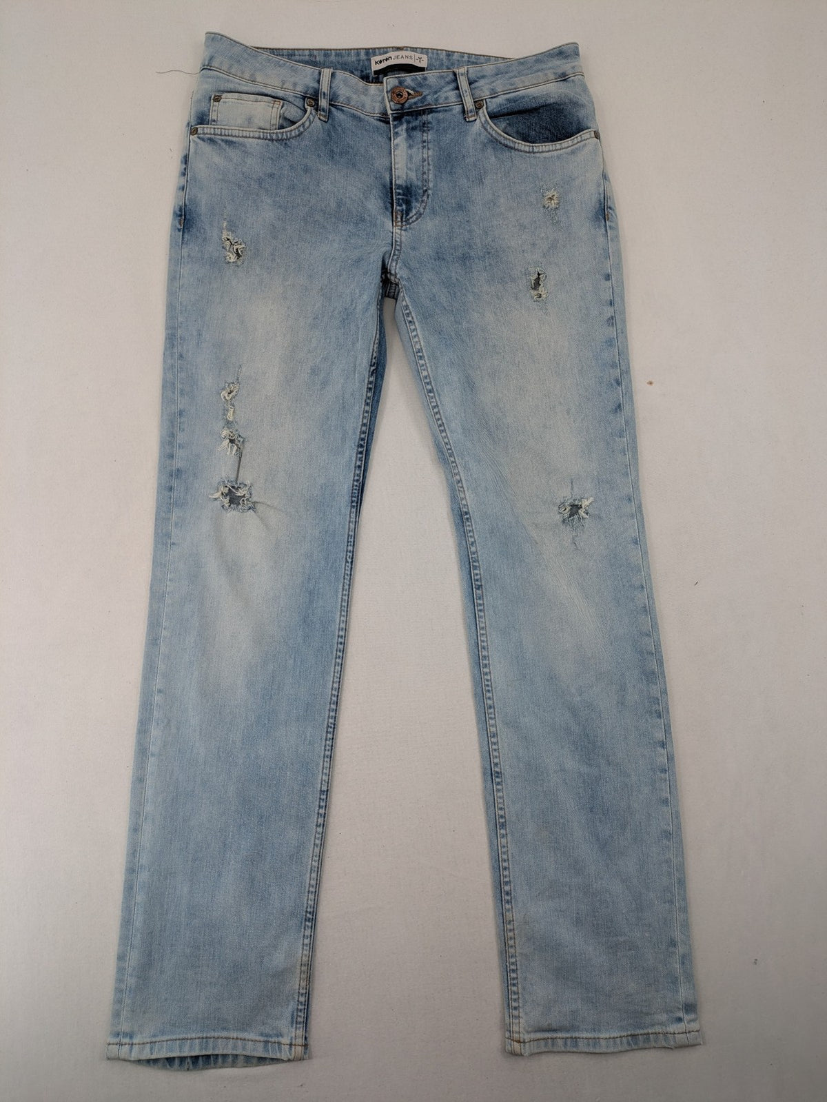 Koton Jeans blue straight jeans with distressed details and classic 5-pocket style.