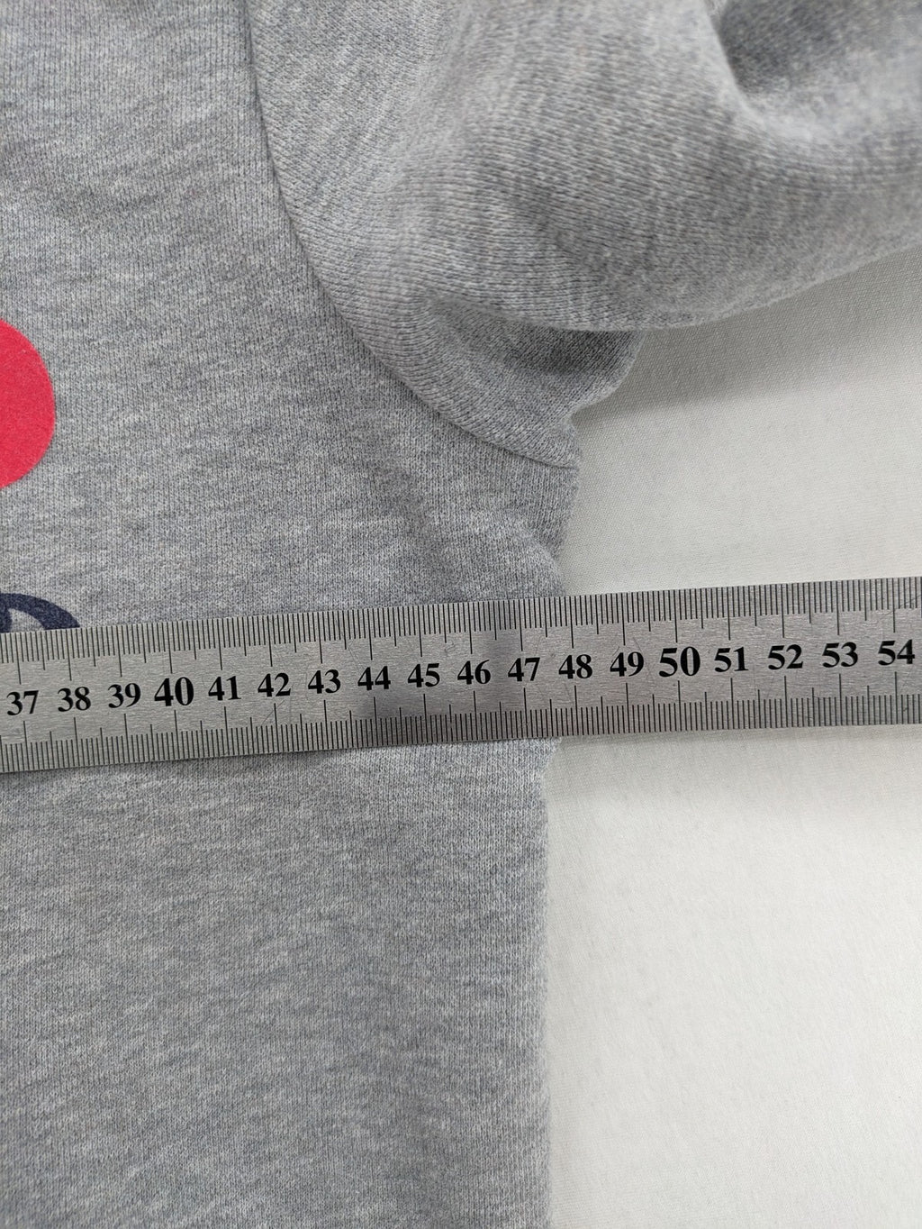 Superdry grey hoodie with Sonics logo, number 7 detail, kangaroo pocket, and drawstring hood.