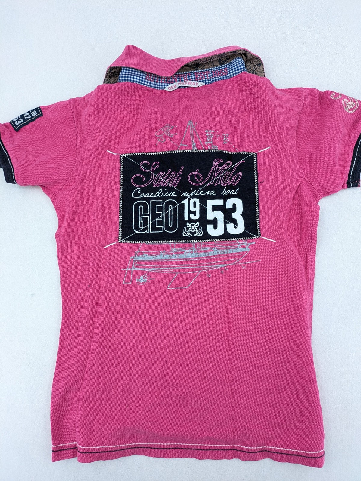 Geographical Norway pink polo shirt with embroidered Saint Malo design and Gingham trim.