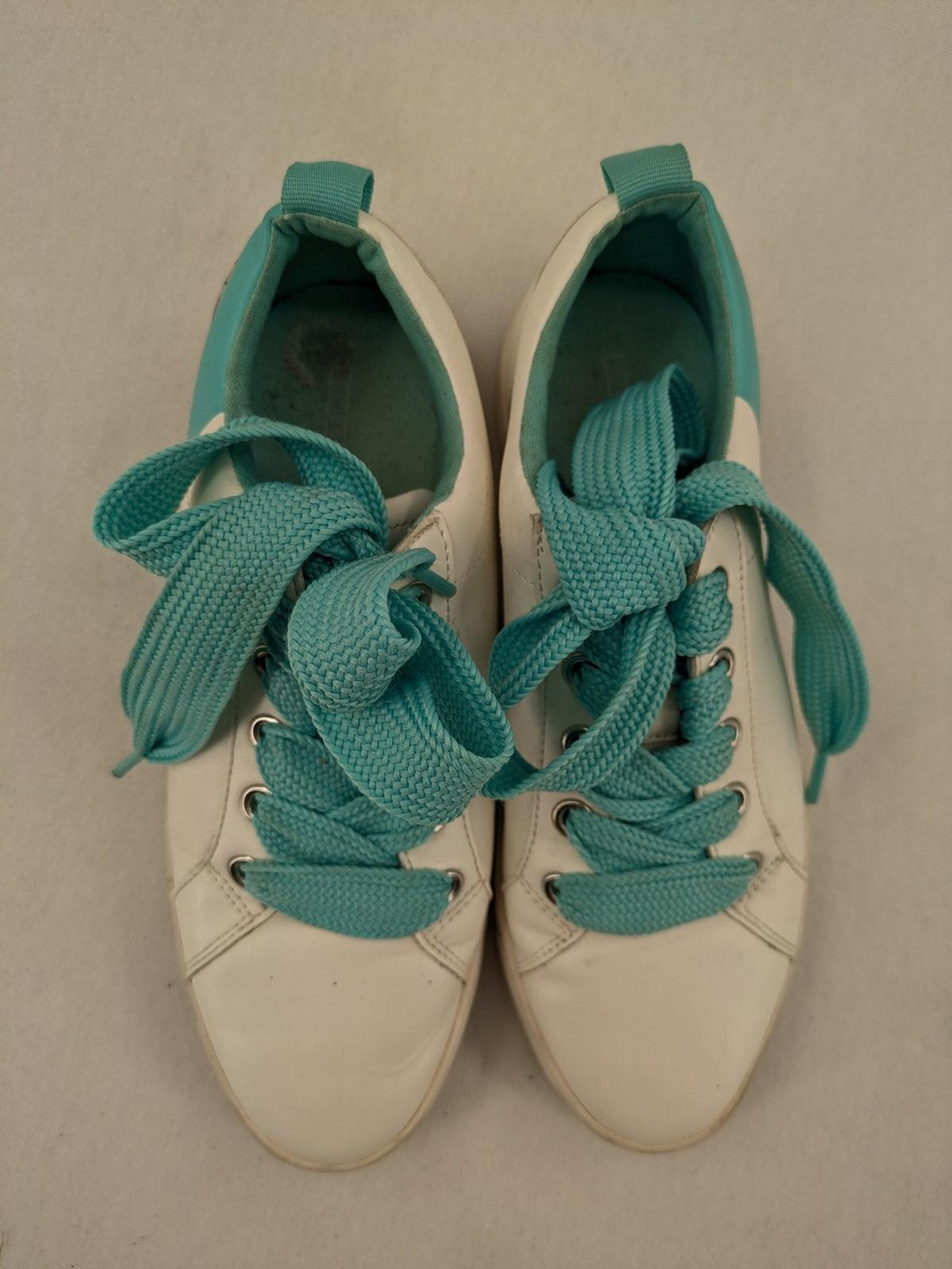 Esprit women's sneakers white with turquoise accents and wide laces.