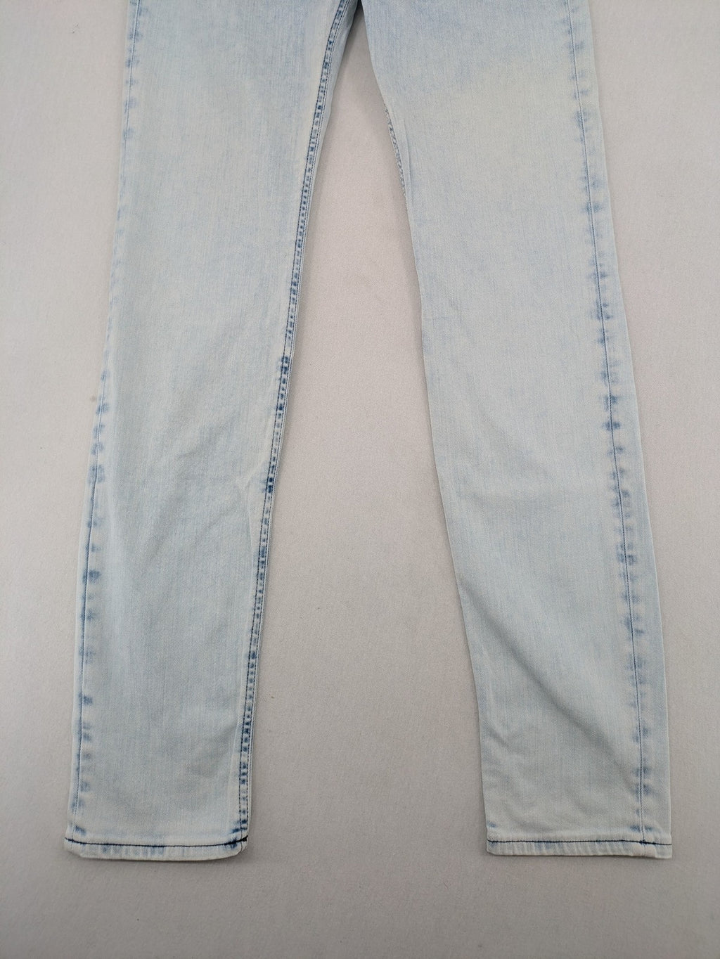 Drykorn blue slim fit jeans with acid wash and leather logo patch.