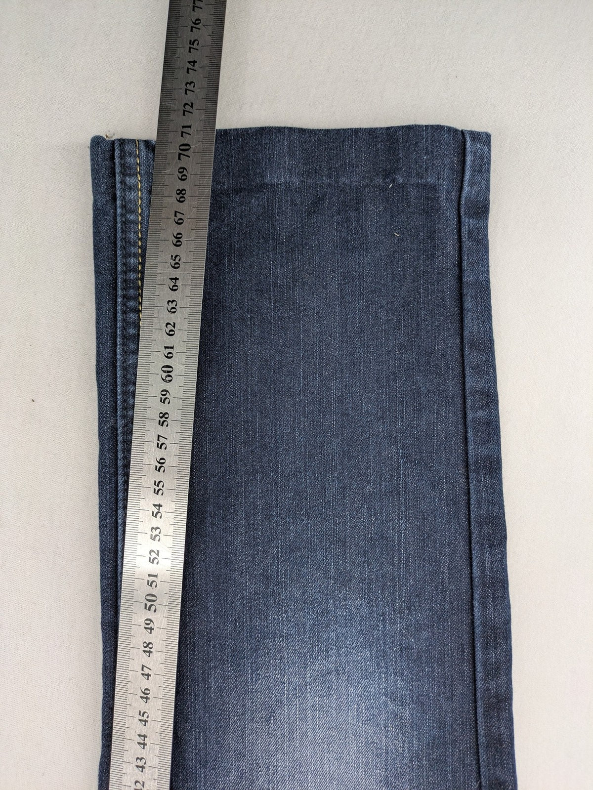 C&A blue straight leg jeans with classic 5-pocket design and faded wash details.