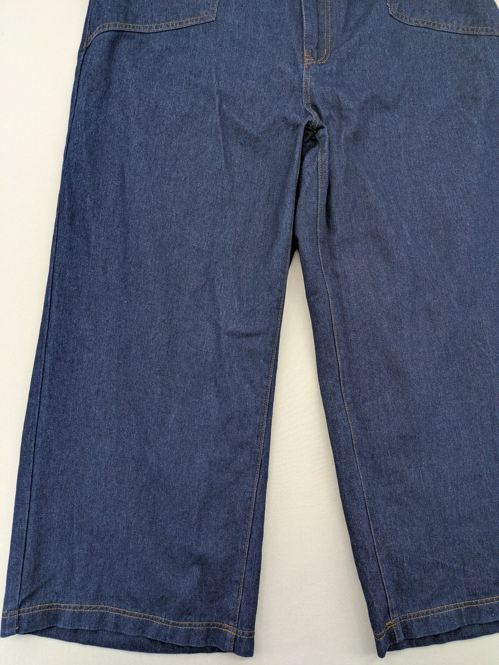 Emery Rose pink culotte pants with wide legs, double button closure, and soft denim blend.