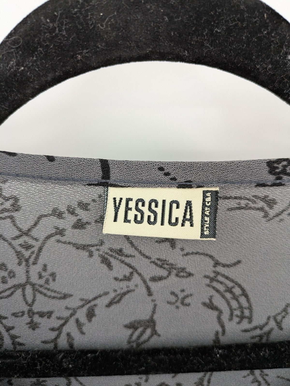 Yessica grey black floral pattern tunic top with round neckline and long sleeves.