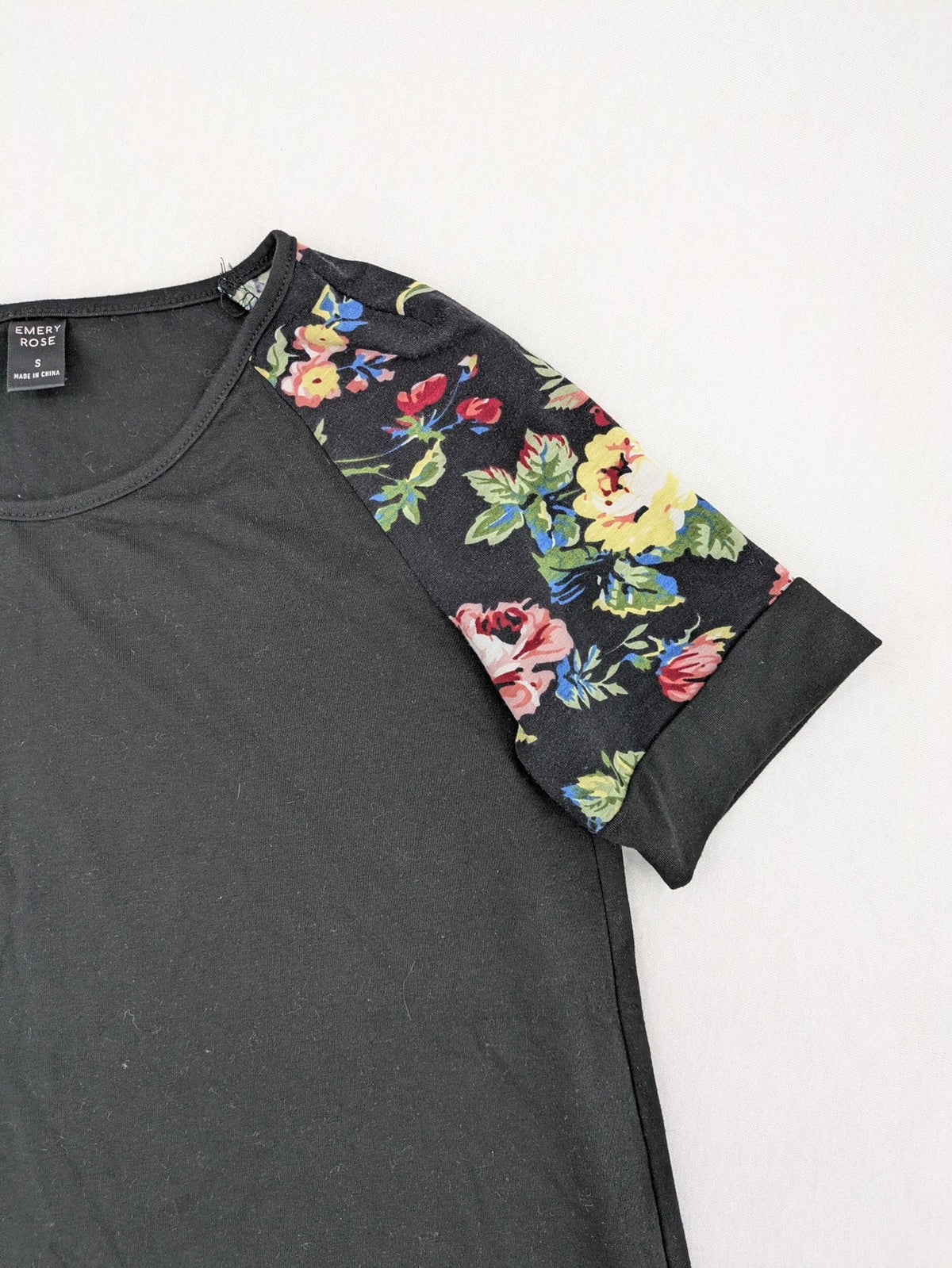 Emery Rose pink T-shirt with floral raglan sleeves and round neckline.