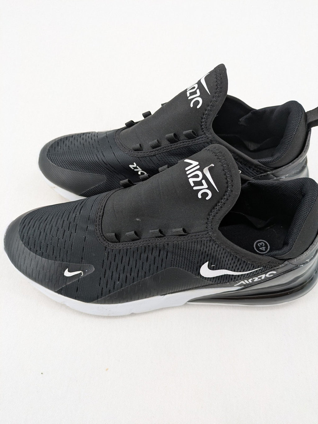 Nike Air Max 270 black and grey sneakers with large Air unit and white accents