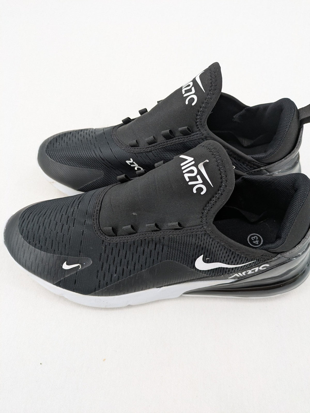 Nike Air Max 270 black and grey sneakers with large Air unit and white accents