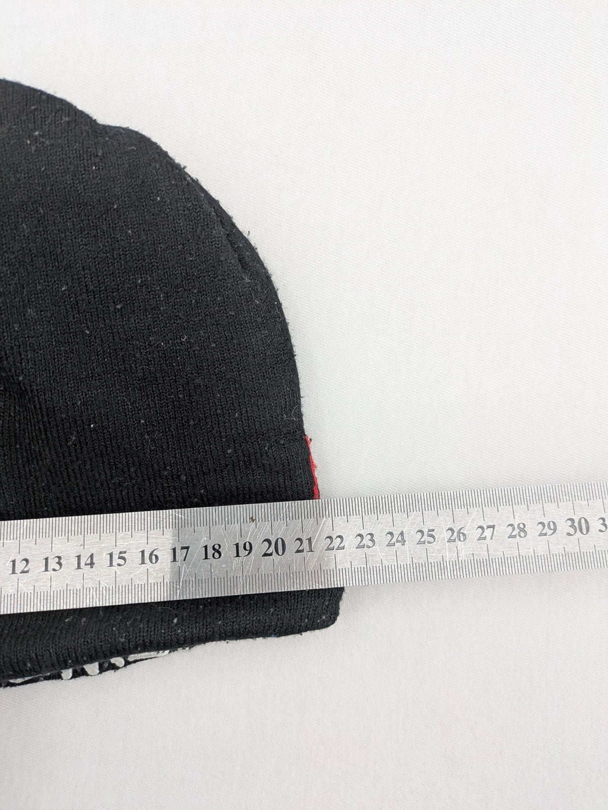 Star Wars black and red reversible beanie featuring Chewbacca graphic and logo.