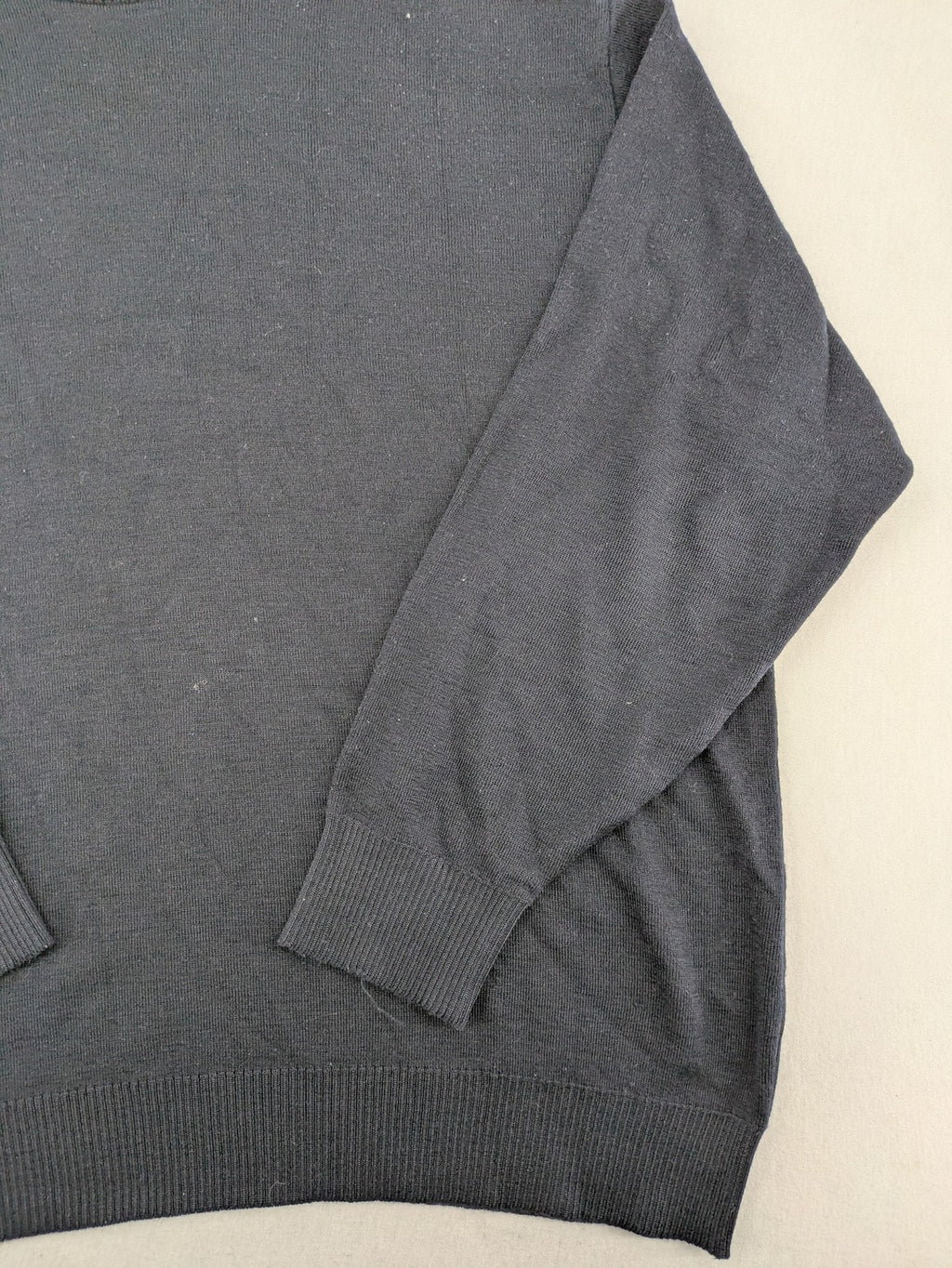 Dinovo grey knit jumper with ribbed roll neck and cuffs, made from merino wool blend.