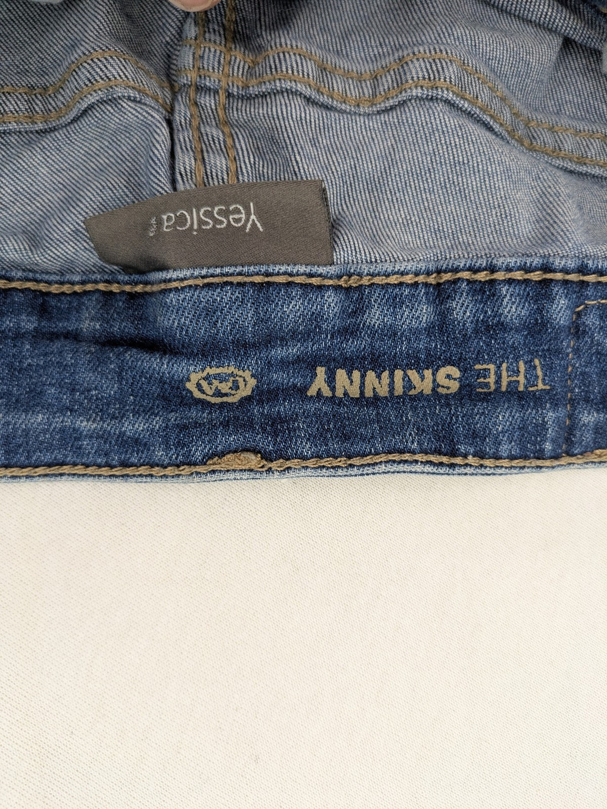 Yessica blue skinny jeans with two-tone side stripe and classic five-pocket design.