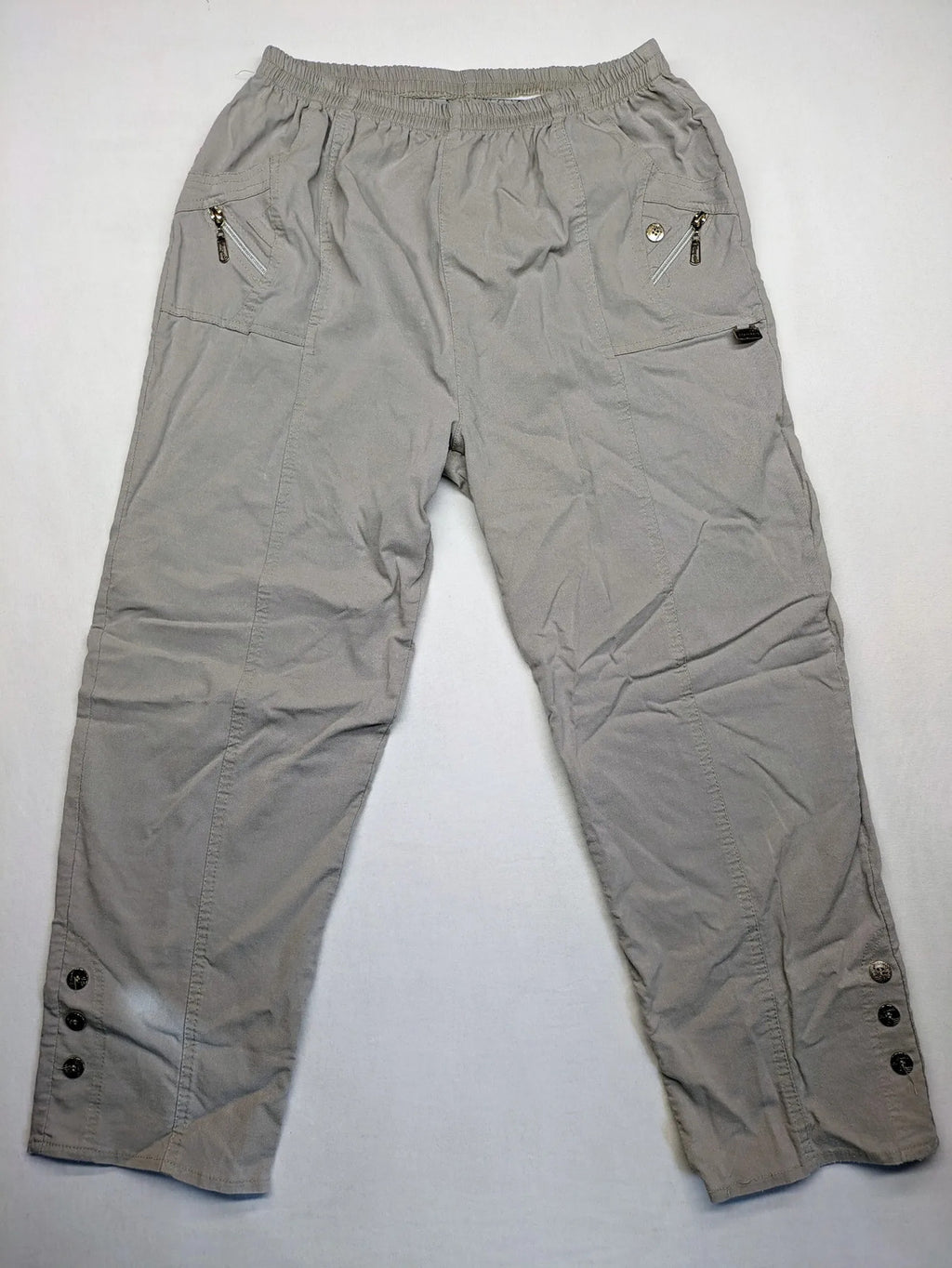 Cherry Berry khaki capri pants with elastic waistband and decorative buttons, featuring logo and zip pockets.