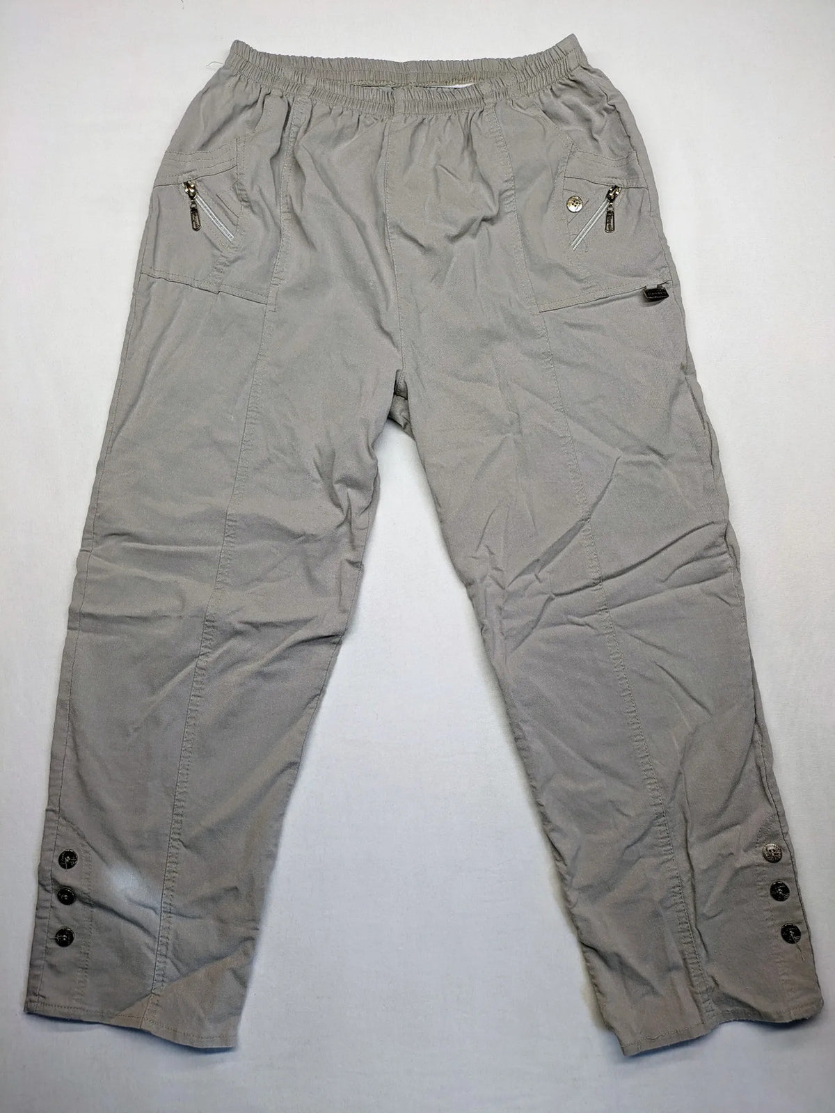 Cherry Berry khaki capri pants with elastic waistband and decorative buttons, featuring logo and zip pockets.