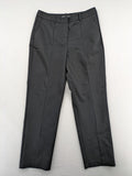 Zara black pants with front creases, subtle slit hem, and buttoned back pocket.