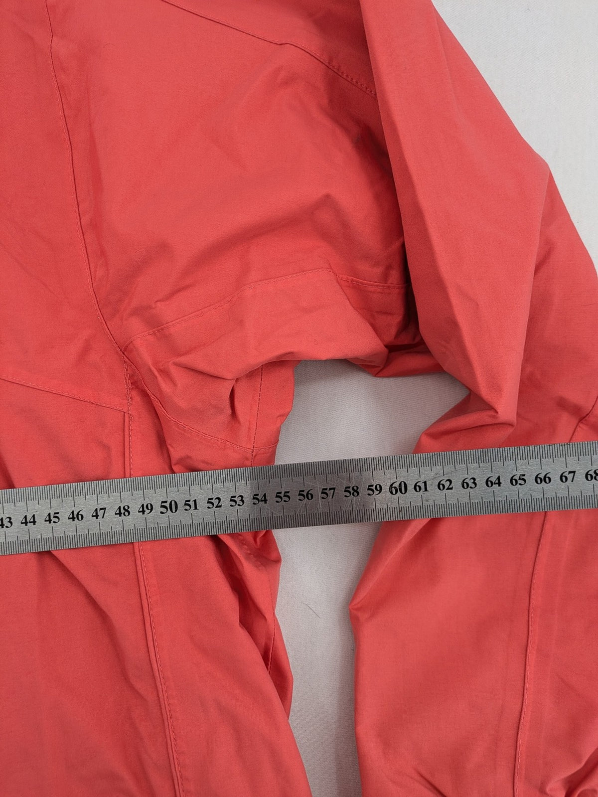 Black Bear black rain jacket with coral pink mesh lining and full zipper.
