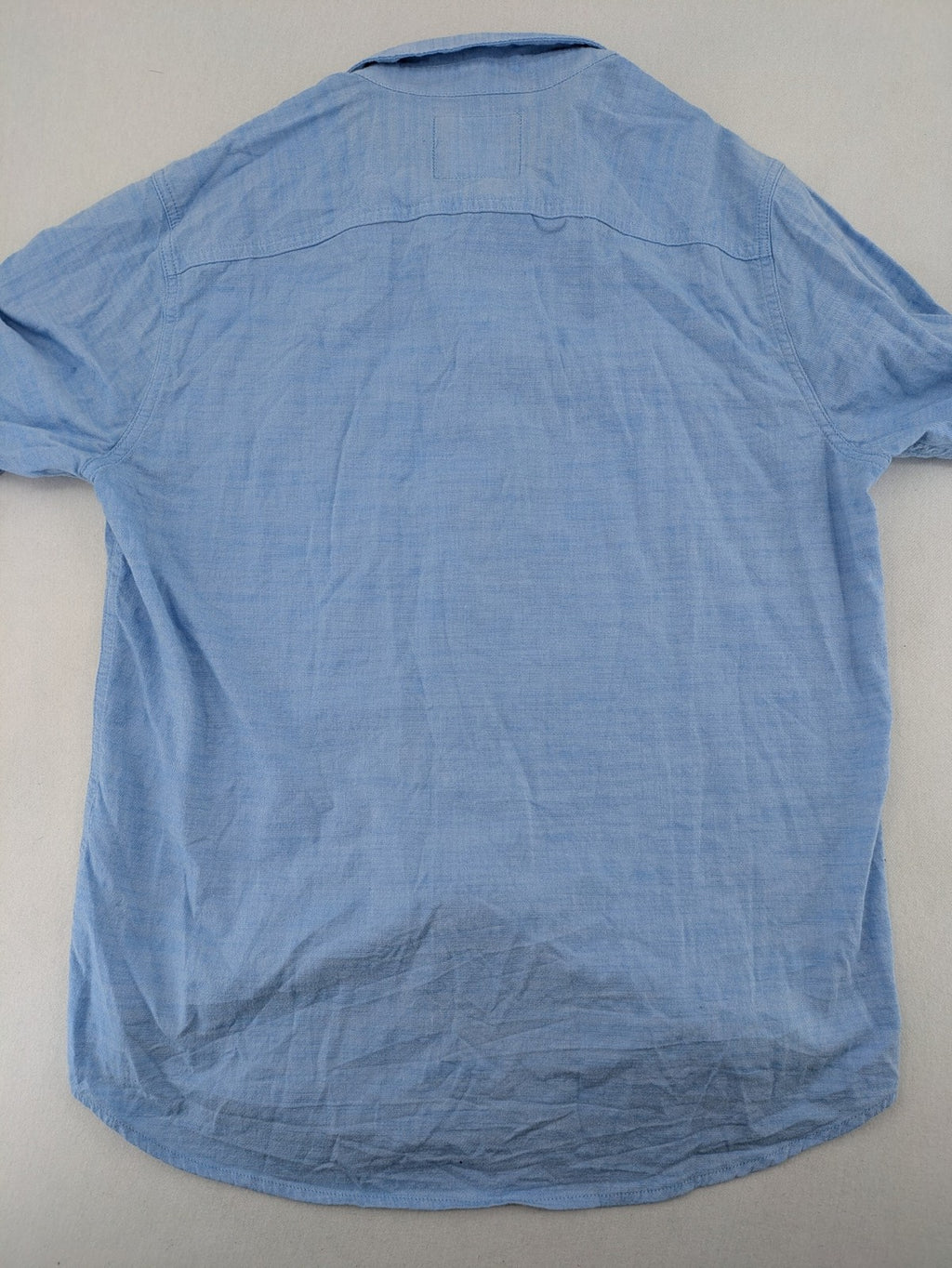 Hollister blue button-down shirt slim fit with embroidered logo and chest pocket.
