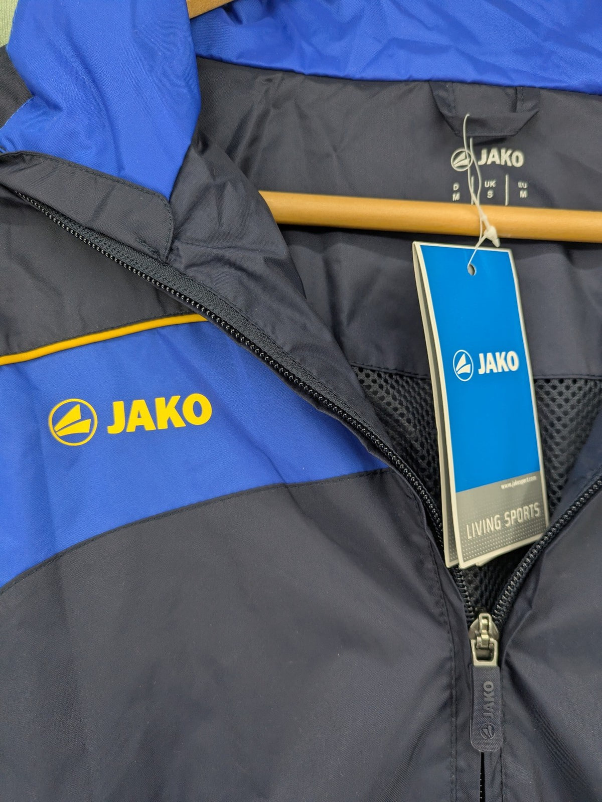 Jako navy windbreaker full zip jacket with breathable mesh lining and logo details.