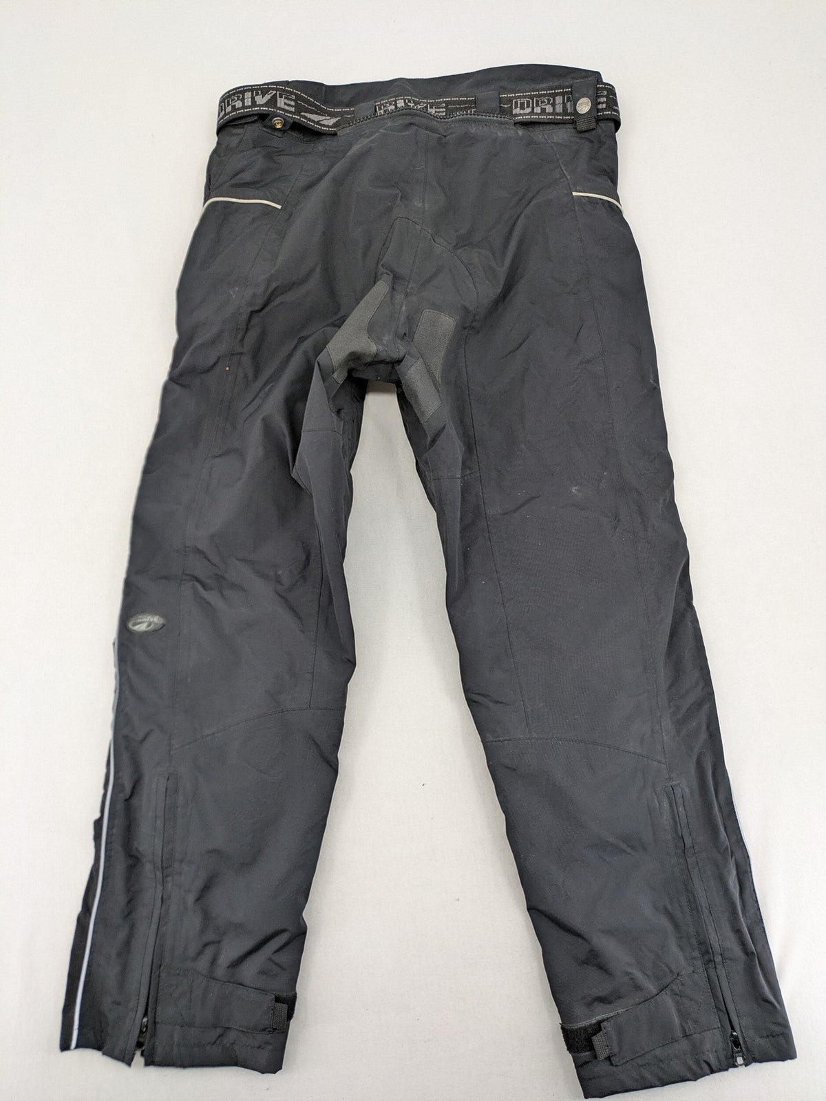 Polo black chaps with grey and white accents, featuring protective knee pads and adjustable belt.
