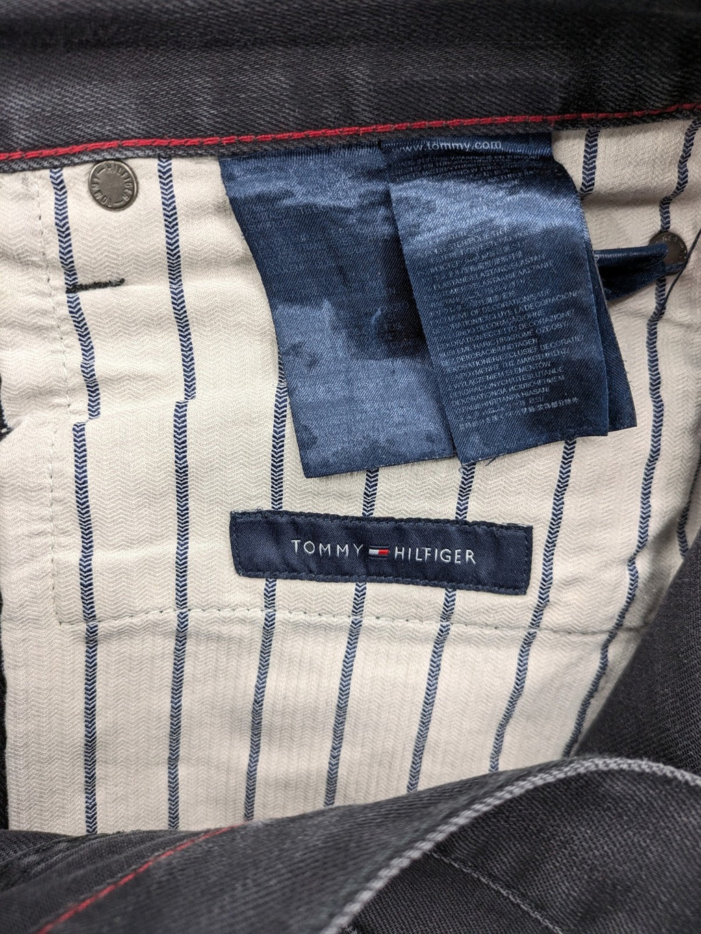 Tommy Hilfiger grey straight jeans faded denim with iconic logo detail.