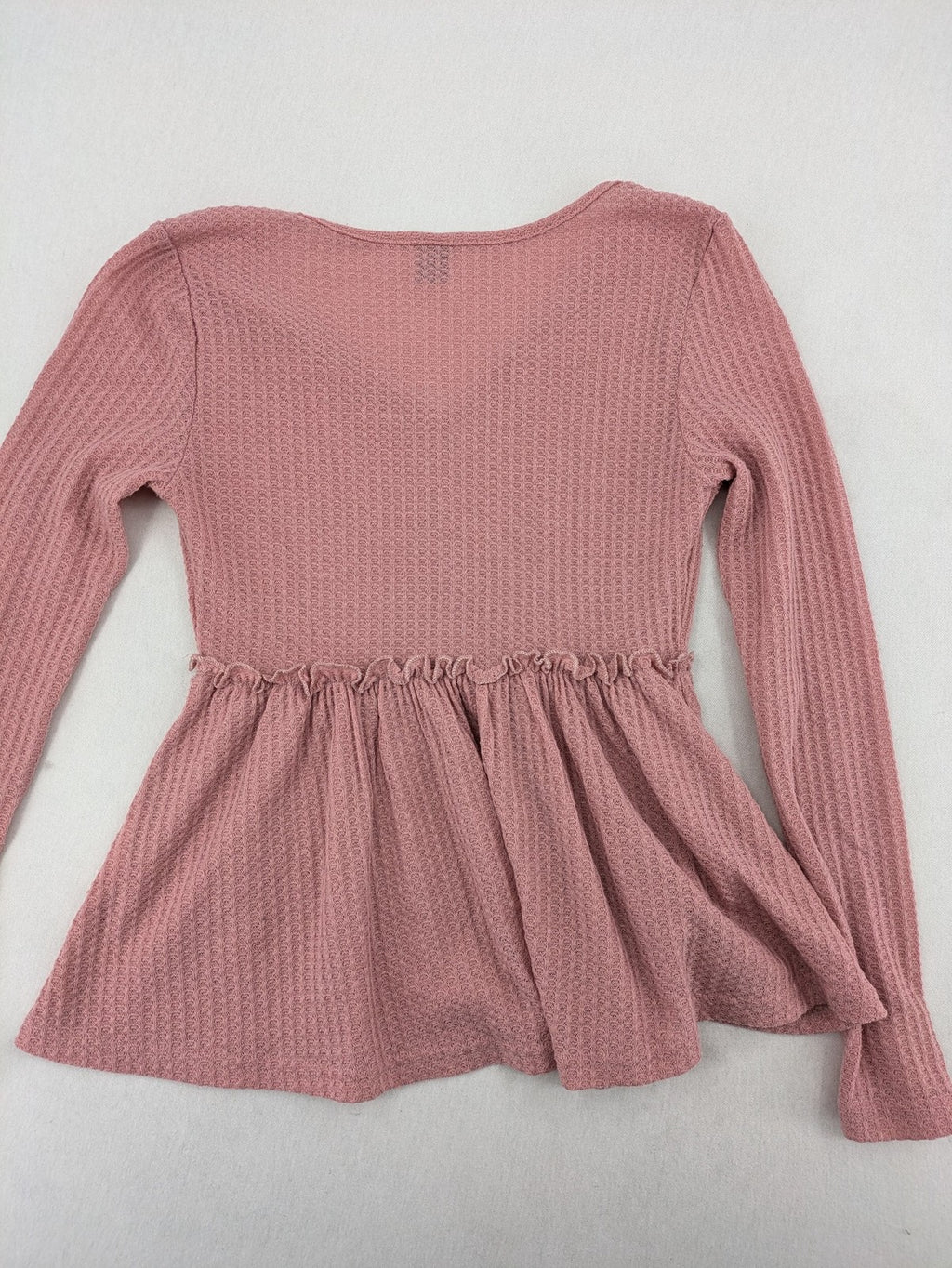 SHEIN pink top V-neck with ruffled waist and three decorative buttons, waffle knit fabric.