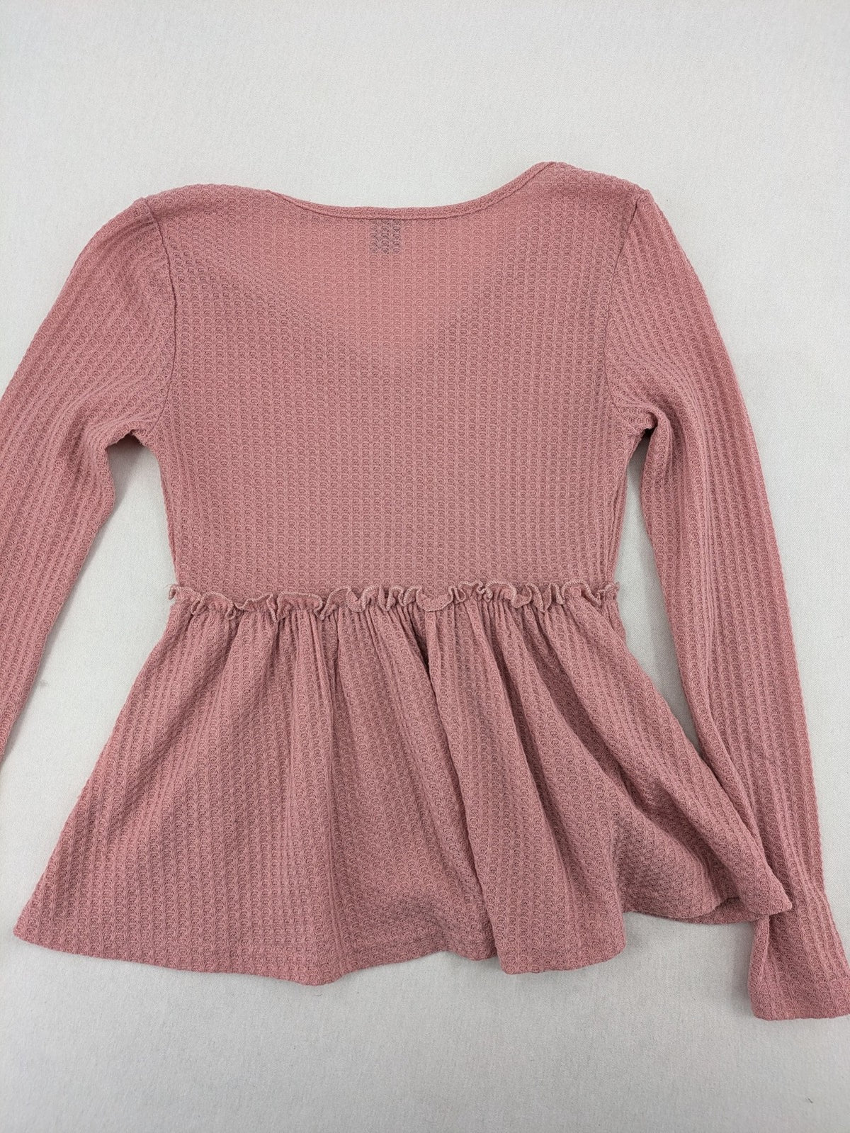 SHEIN pink top V-neck with ruffled waist and three decorative buttons, waffle knit fabric.