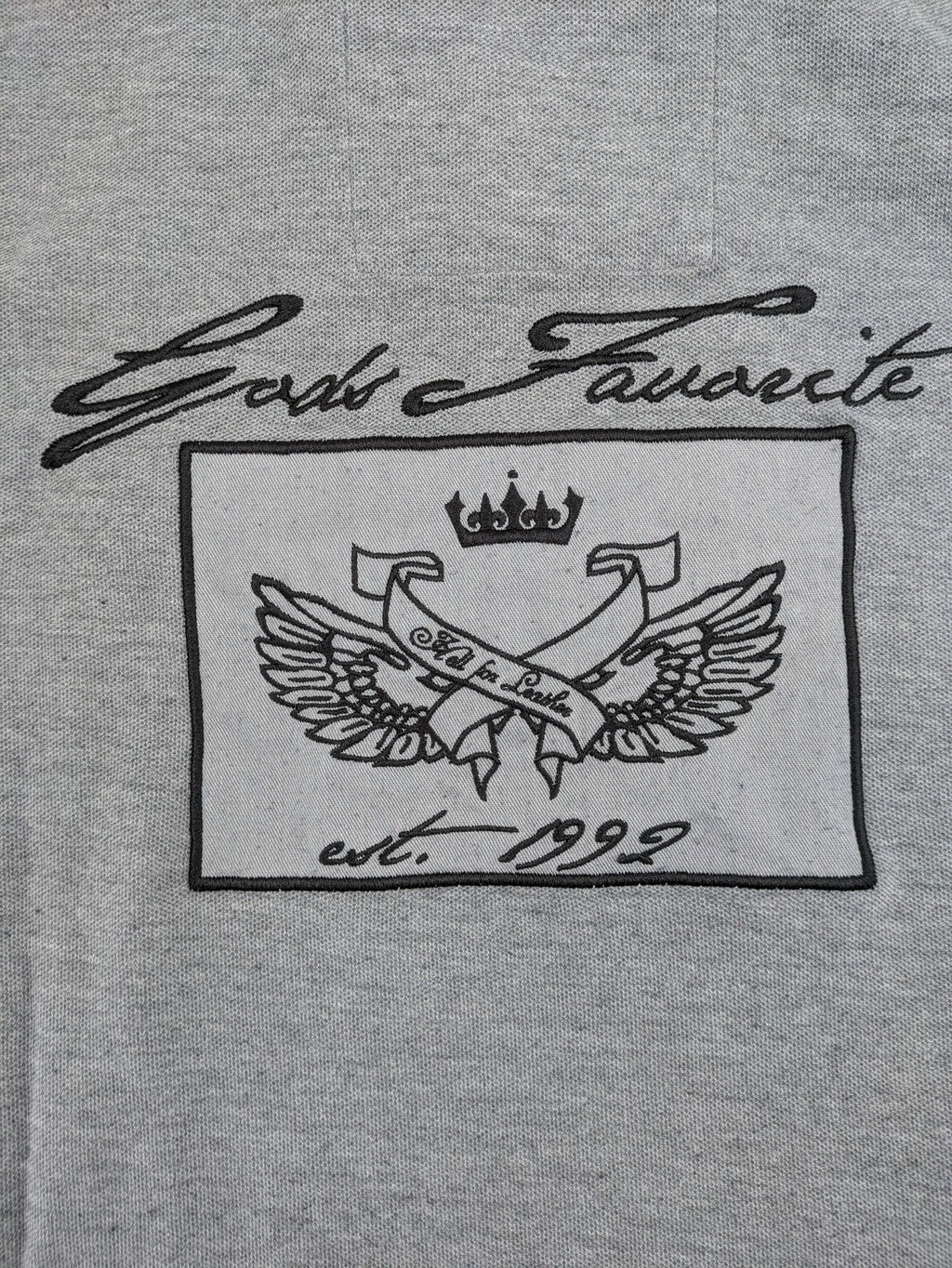 Götter & Helden grey polo shirt with "Gods Favorite" embroidery and contrasting collar details.